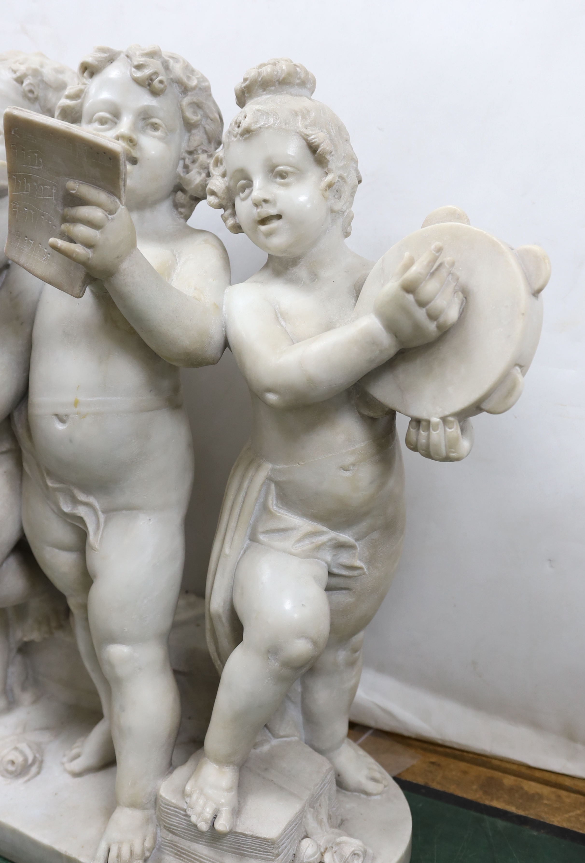 After the Ferdinando Vichi Gallery. An Italian white Carrara marble group 'Musica', Please note this lot attracts an additional import tax of 5% on the hammer price